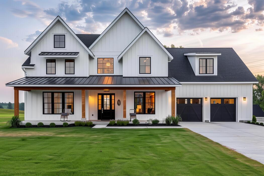white-house-with-black-roof-and-garage-photo